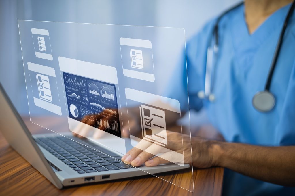 Person reviewing digital information on a laptop